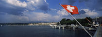 Swiss flag fluttering at the lakeside, Lake Geneva, Geneva, Switzerland von Panoramic Images