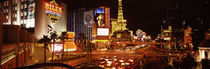 Buildings in a city lit up at night, The Strip, Las Vegas, Nevada, USA by Panoramic Images