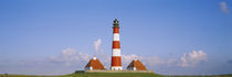 Lighthouse on a landscape, Westerhever Lighthouse, Schleswig-Holstein, Germany by Panoramic Images