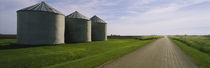 Three silos in a field by Panoramic Images