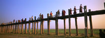 Myanmar, Mandalay, U Bein Bridge, People crossing over the bridge by Panoramic Images