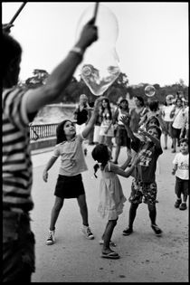 Children & soap bubbles in Parque del Retiro. Madrid, 2010. by Maria Luros