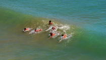 Young enjoying the waves by Ramon Cami