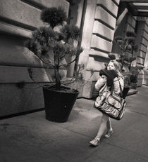 Brisk young walker, NYC by Ron Greer