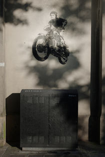 Graffitti stencil of jumping motorbike. by Tom Hanslien