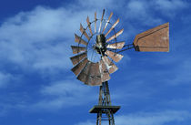 Windmill against blue sky by Danita Delimont