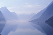 Vertical walls reflected in calm Eikesdalsvetnet near the village of Osen by Danita Delimont