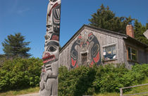 Totem pole and tourist shop by Danita Delimont