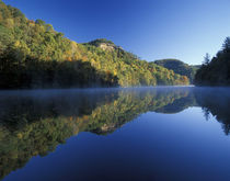 Autumn colors mirrored on Millcreek Lake by Danita Delimont