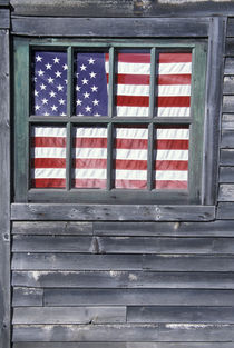 Flag of the United States in window of abandoned store by Danita Delimont