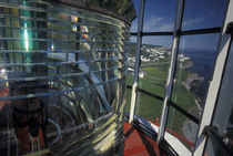 Lightbulb and fresnel lens at Cap-de-Rosiers Lighthouse by Danita Delimont