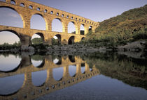 Roman aqueduct and bridge; sunset light by Danita Delimont