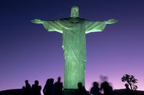The Christ Statue on Corcovado mountain at night with greenish floodlights by Danita Delimont