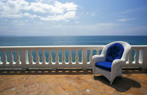 Wicker chair and tiled terrace at the Hornet Dorset Primavera Hotel by Danita Delimont