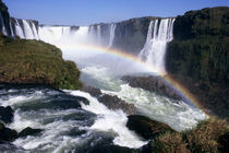 Aerial view of the waterfalls with a rainbow over them by Danita Delimont