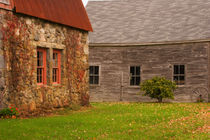 Old stone building and wooden barn in fall in rural New England von Danita Delimont
