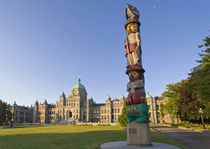 Totem pole at the Parliament building in Victoria British Columbia Canada by Danita Delimont