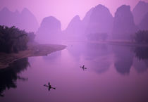 Fishermen on raft in Li River by Danita Delimont