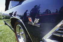 Reflection of 1997 Chevrolet Stingray in 1969 Chevrolet Malibu convertible von Danita Delimont