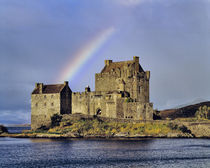 A rainbow greets visitors at Eilean Donan Castle on Loch Doich in the Highland of Scotland by Danita Delimont
