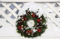 Christmas wreath on fence by Danita Delimont