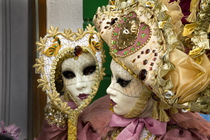 Woman dressed in costume for the annual Carnival festival looks in mirror von Danita Delimont