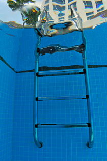 Ladder of swimming pool by Sami Sarkis Photography