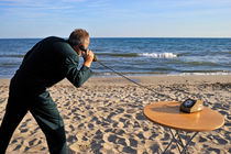 Businessman on beach with Landline Phone by Sami Sarkis Photography