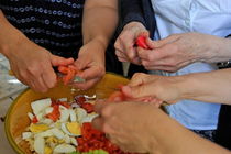 Preparing salad by Sami Sarkis Photography