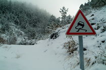 Slippery warning road sign by Sami Sarkis Photography