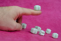 Polystyrene cube on man's finger von Sami Sarkis Photography