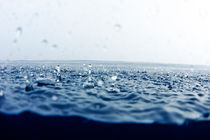 Rain drops falling into ocean by Sami Sarkis Photography