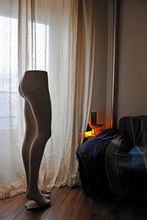 Mannequin legs by sofa in living room by Sami Sarkis Photography