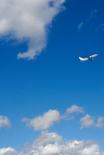 Commercial airplane in flight by Sami Sarkis Photography