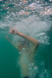 Boy diving in lake by Sami Sarkis Photography