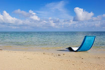 Sun lounger on tropical beach by Sami Sarkis Photography