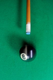 Pool cue striking black Eight ball by Sami Sarkis Photography