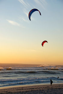 Kite surfers on beach at sunset by Sami Sarkis Photography