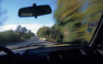 Speeding car on country road von Sami Sarkis Photography