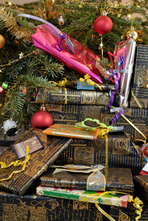 Gift wrapped presents under Christmas tree by Sami Sarkis Photography