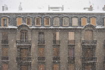 Snow falling on old building by Sami Sarkis Photography