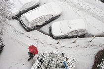 Woman with umbrella under snow von Sami Sarkis Photography