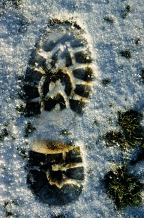 Footprint in snow by Sami Sarkis Photography