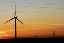 Windmill and pylons silhouettes at dusk by Sami Sarkis Photography