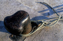 Rope tied around bollard by Sami Sarkis Photography