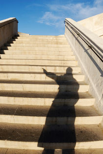 Man casting shadow on steps by Sami Sarkis Photography