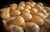 Bread dough resting in preparation of being cooked in a bakery by Sami Sarkis Photography