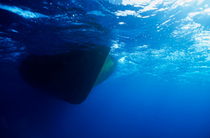 Hull of a boat is seen from underwater Soraya Reef by Sami Sarkis Photography