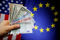 Man's hand with US and Euro banknotes on European Union and US Flag von Sami Sarkis Photography