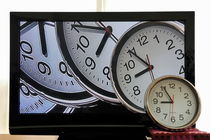 Multiple clocks on TV screen by Sami Sarkis Photography